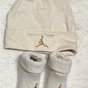 Air Jordan Infant Beanie and Socks in Cream and Gold. Size 6-12 months